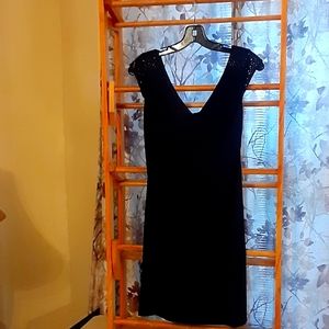 A beautiful black sleeveless dress by Connected Petite